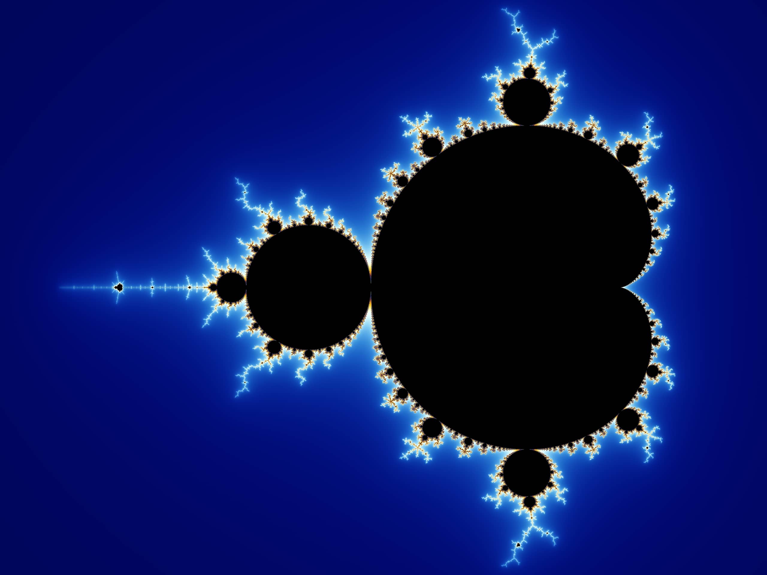 L'insieme di Mandelbrot completo, figura nera a forma di cardioide con bolle e filamenti colorati